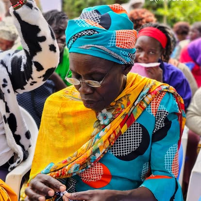 A woman gaining a new income-generating skill through pad-making training