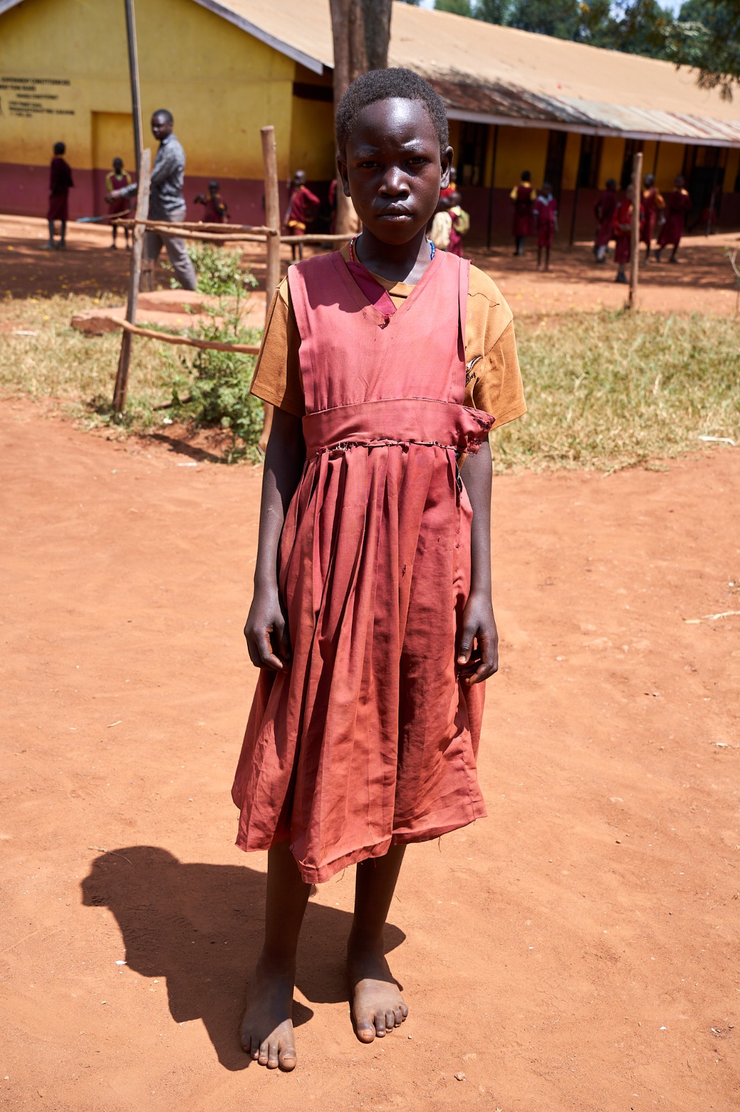 Before: a learner in a worn, torn dress